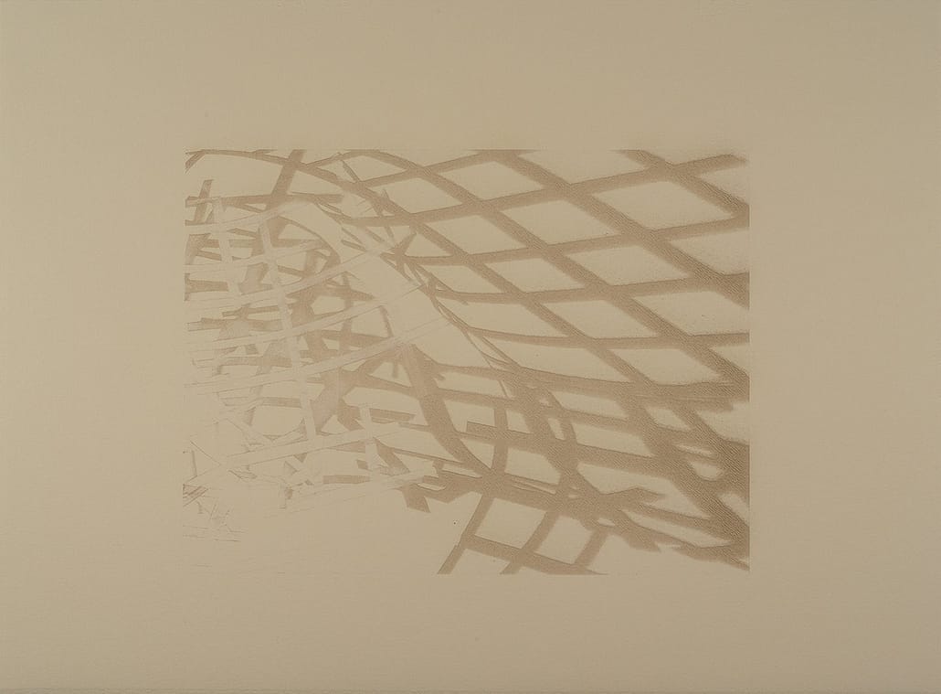 Urban Shadows 45 A shadow of a fence on the wall.