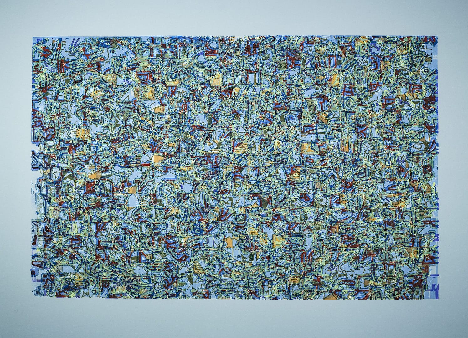 A close up of the surface of a blue and yellow wall.